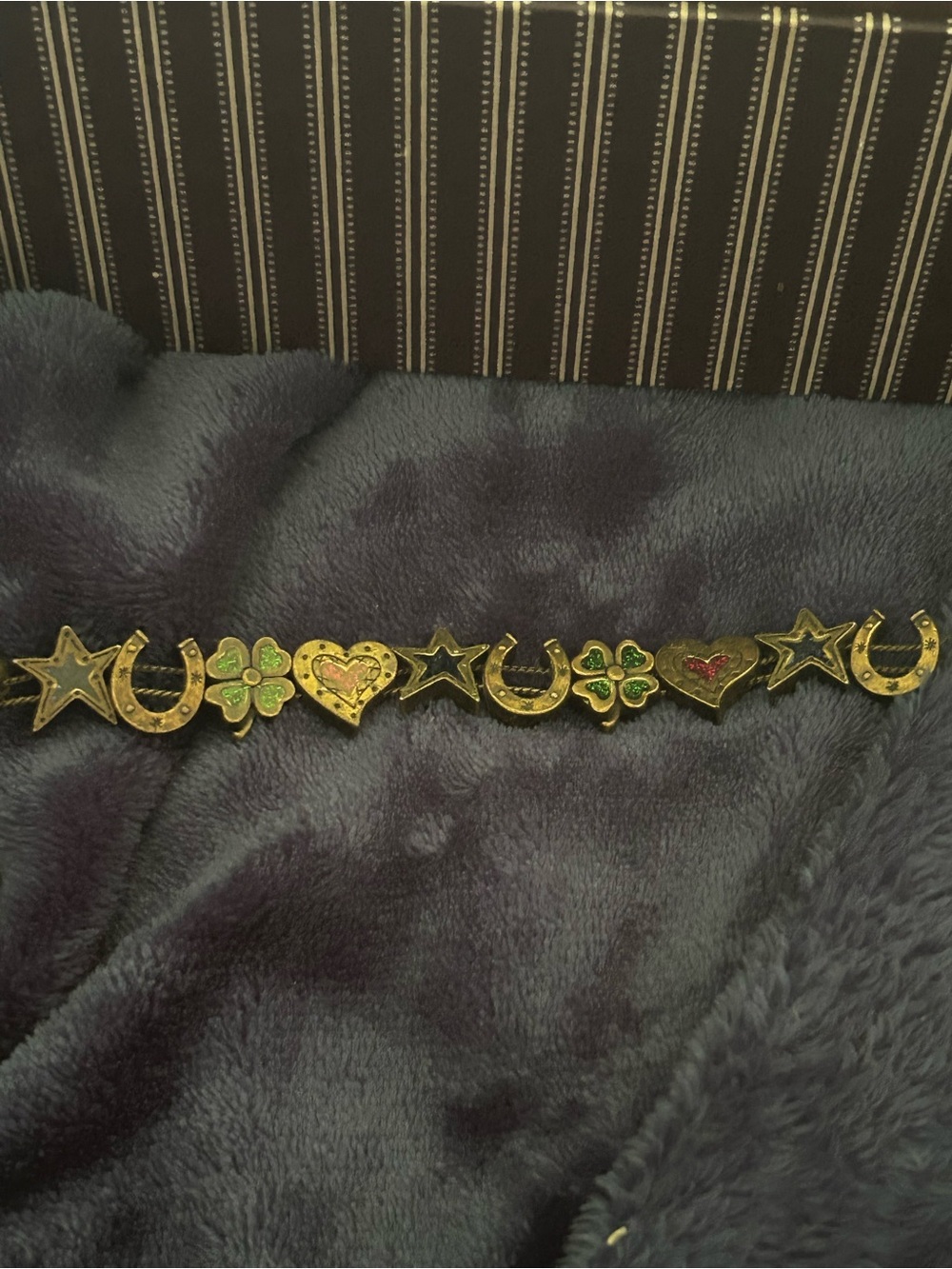 Vintage Avon Panel Bracelet featuring Western-themed "good luck" charms.